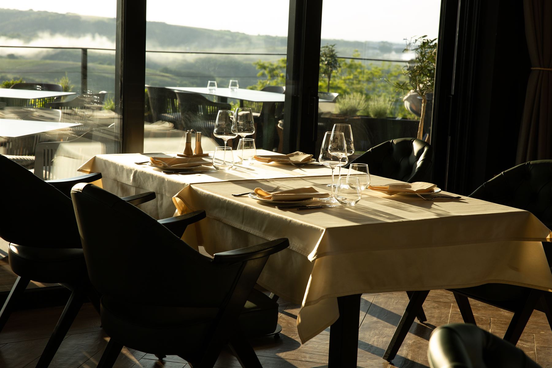 A laid table at the Pećina Stroga restaurant looking out over Fruška Gora